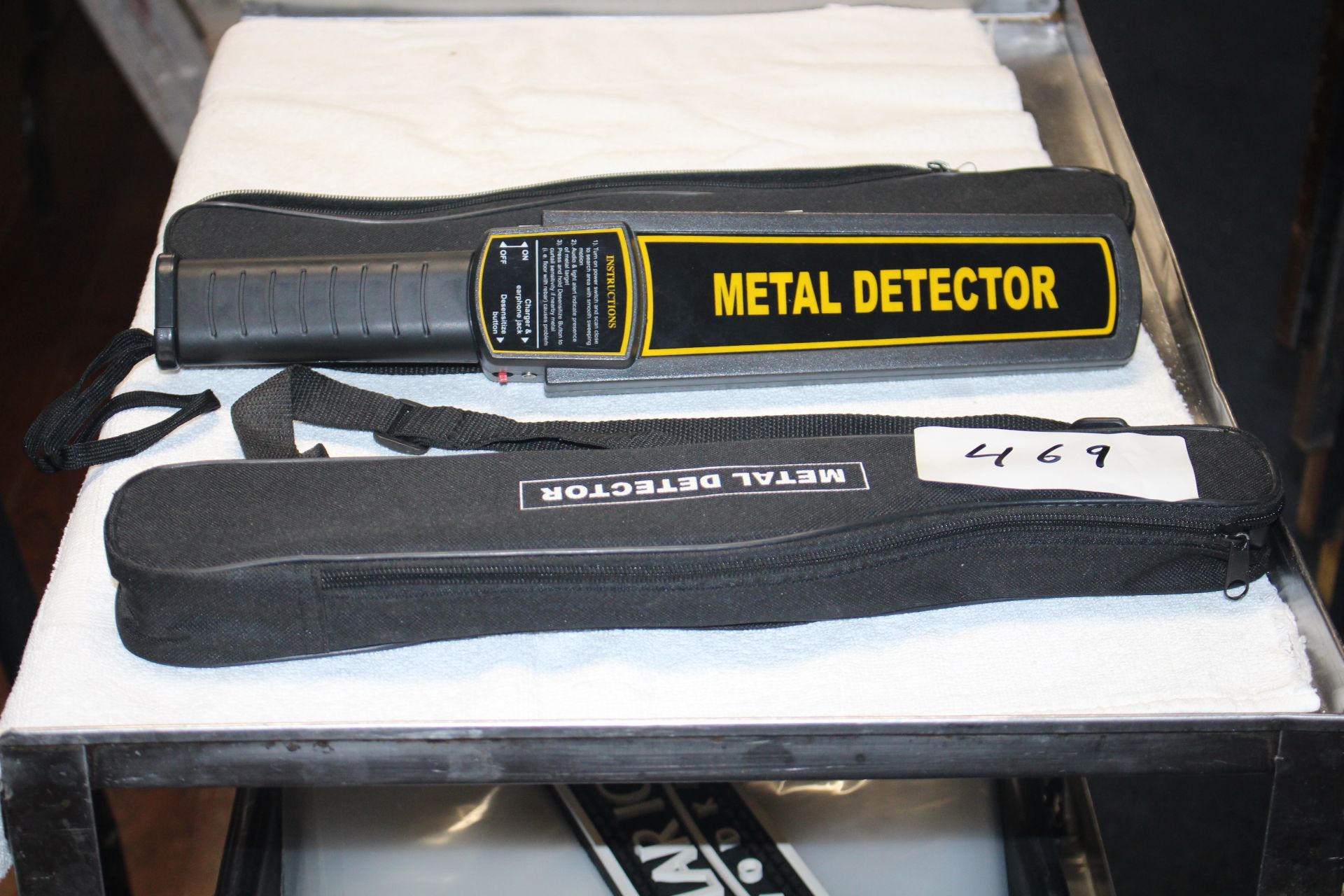 Lot 2 handheld battery operated metal detector w/ carrying case