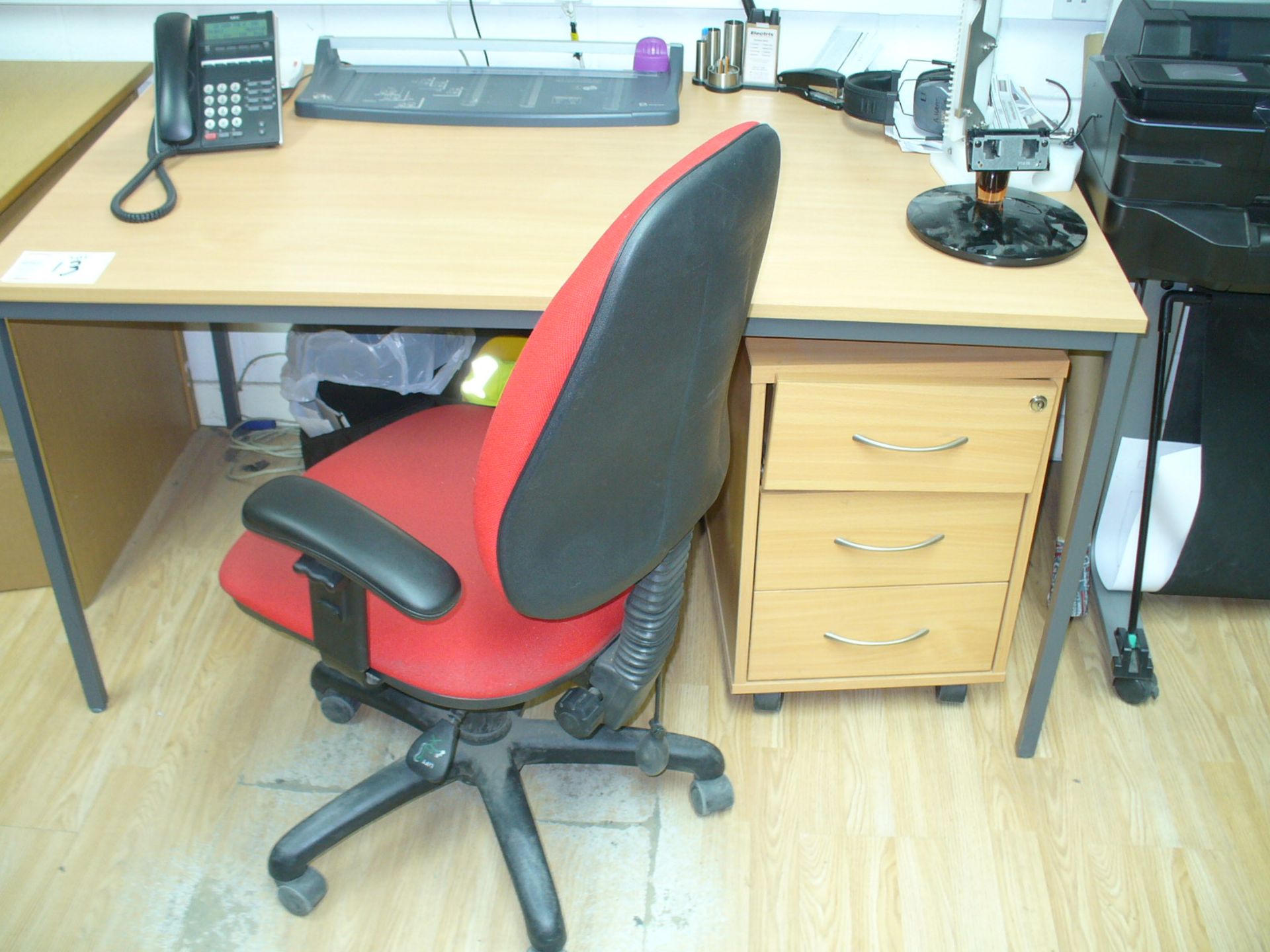 Beech effect TABLE, 3 drawer PEDESTAL and red fabric upholstered SWIVEL ARMCHAIR