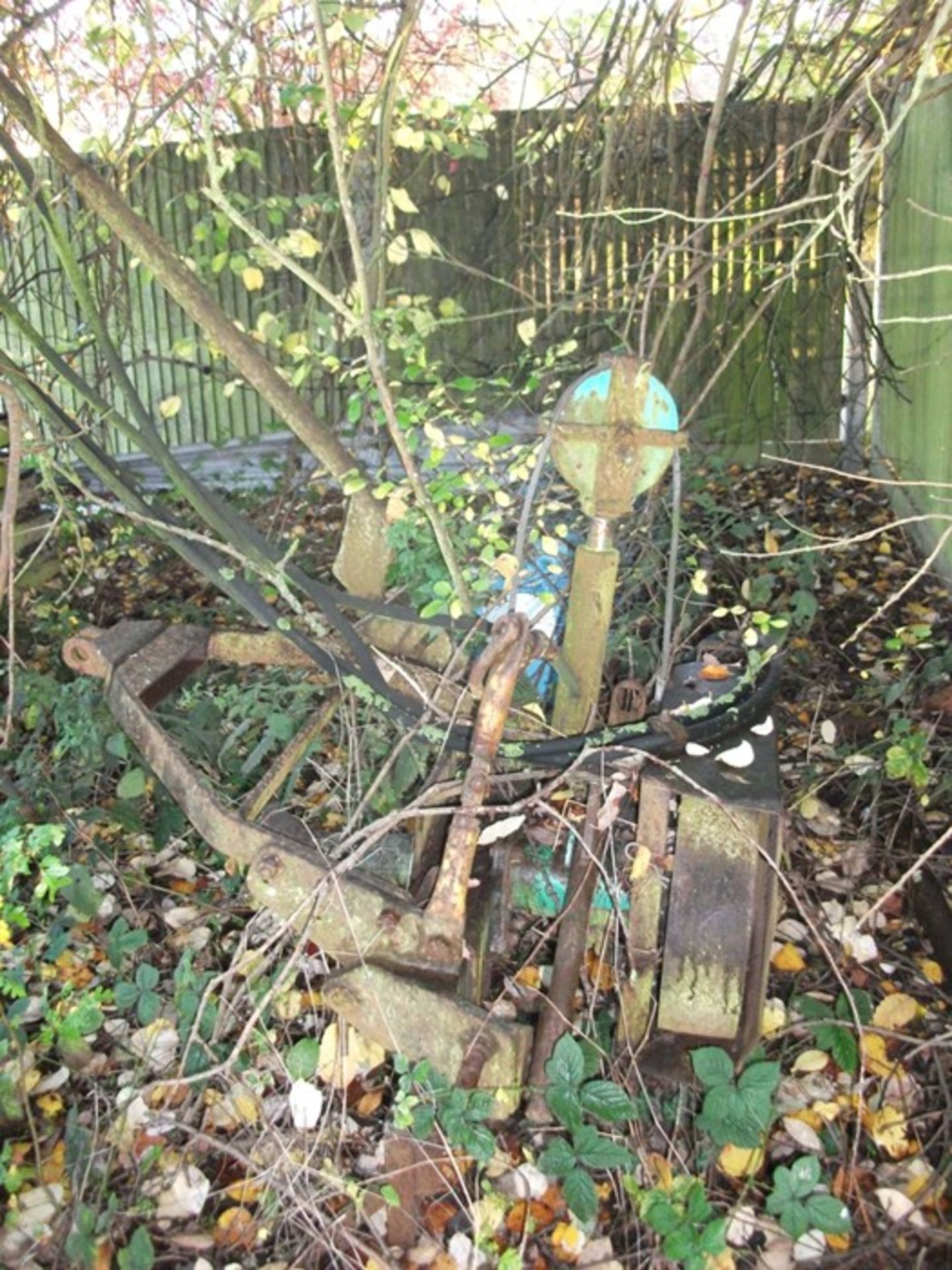 Belt driven hedge cutter with saw and slasher blade