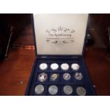 12X ASSORTED COLLECTABLE COINS IN THE ROYAL FAMILY COMMEMORATIVE COIN COLLECTION CASE