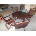 WOODEN OUTDOOR STAINED TABLE AND FOLD UP CHAIRS