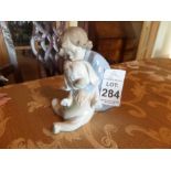 LLADRO NAO YOUNG CHILD WITH TEDDY BEAR FIGURINE