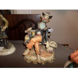 CAPODIMONTE MAN ON BENCH FIGURINE