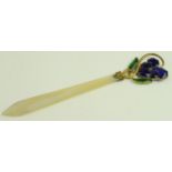 Mother of pearl letter opener with decorative floral handle, slight loss to tip, length 175mm