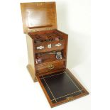 Victorian oak stationary box, opening to reveal letter rack, calendar, two inkwells and pen