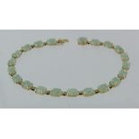 14ct yellow gold and jade tennis bracelet, 19cm long, weight 5.8g