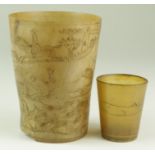 Two horn beakers, circa 19th Century, the larger one decorated with a fox hunting scene (damaged