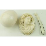 Three antique ivory items, comprising cameo brooch, egg & pen knife in the form of a horses leg &