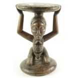 African Luba tribe foot stool, depicting a kneeling African woman, height 43cm, diameter 28cm