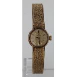 Ladies 9ct cased Omega wristwatch circa 1970, on a 9ct integral strap. Total weight 17.8g