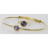 18ct gold bangle and ring each set with a single Star Sapphire. Total weight 14.9g