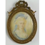 Portrait Miniature. Oil on ivory, depicting a portrait of lady with blond hair in a blue dress (