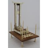 Guillotine. An unusual hand made guillotine made from bone and wood, circa early 20th Century,