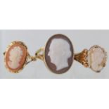 Three cameo rings. 9ct yellow gold large oval ring, size M, weight 5.4g. 9ct yellow gold scroll