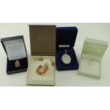 Four Boxed Silver Pendants/Brooches in original cases