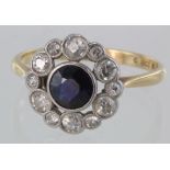 18ct and platinum sapphire and diamond cluster ring, centre sapphire surrounded by diamonds