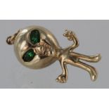 9ct Gold Alien charm with green stones for eyes, length 35mm approx., total weight 10g approx.