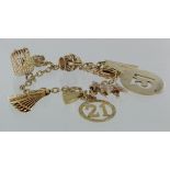 9ct charm bracelet with nine charms attached, padlock clasp and safety chain, weight 26g