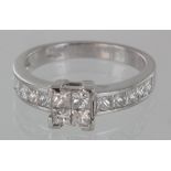 Platinum ring. four corner set with four princess cut diamonds. Channel set with five princess cut