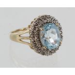9ct yellow gold blue topaz and diamond cluster ring, finger size M, weight 4g