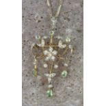 9ct yellow gold pendant/brooch set with peridot and seed pearls on 9ct chain, weight 7.9g