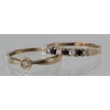 9ct yellow gold diamond solitaire, approx. 0.10ct and 9ct sapphire and cz band ring, both size N,