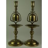 Two large brass Ale House candlesticks, both with incorporated brass bell, height 35cm approx.