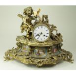 Gilt ormolu mantle clock, mounted with a large cherub, ornately decorated, three hand painted