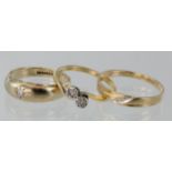 9ct yellow gold single stone gypsy set ring, size R, weight 4.6g. 18ct diamond crossover ring,