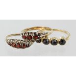 Three 9ct yellow gold garnet set half eternity style rings, total weight 5.6g