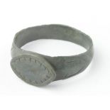 Viking Bronze Dragon Eye Ring, ca. 900 AD, round band with integral elliptical bezel depicting a