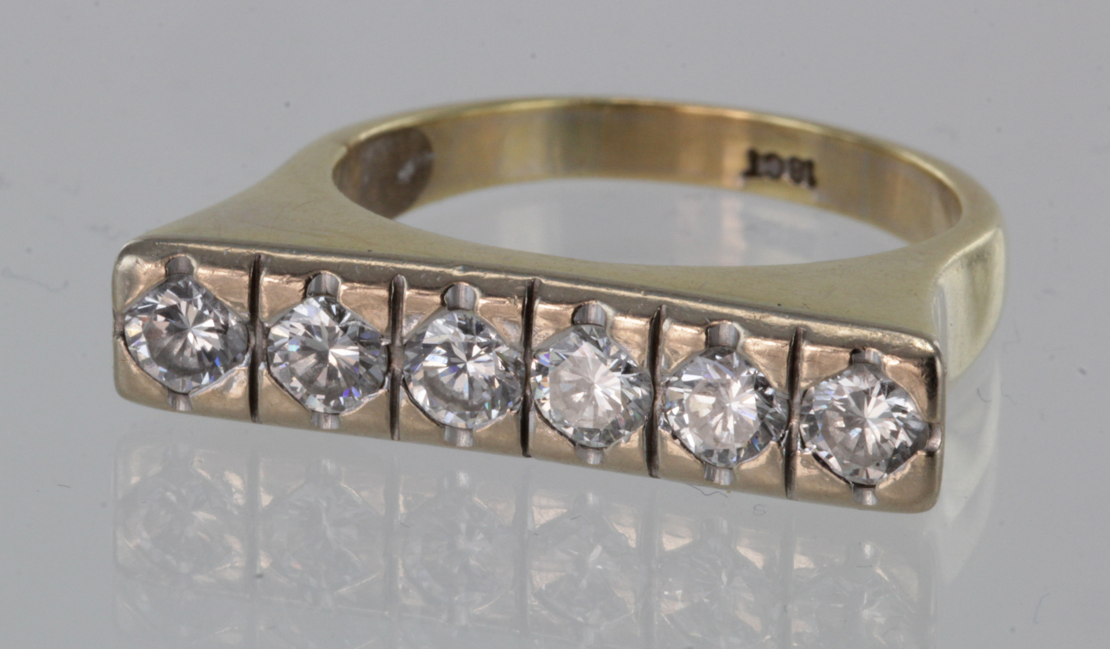 18ct yellow gold bar ring set with six diamonds totalling approx. 0.75ct, finger size R, weight 7.