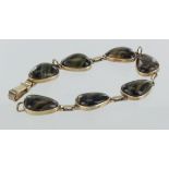 9ct gold tigers eye pear shaped seven stone bracelet with foldover clasp, 19cm long, weight 16g