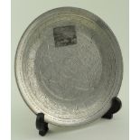 White metal Middle Eastern ornately decorated dish, marks to base, diameter 158mm approx., weight