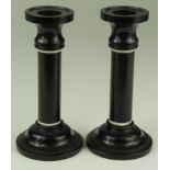 Pair of ebony candlesticks, with ivory bands, circa early 20th Century, height 13cm approx.