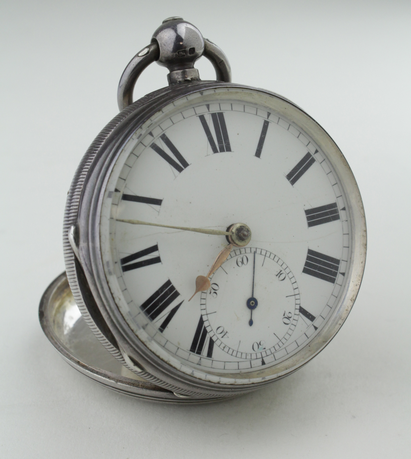 Gents Silver cased open face pocket watch. Hallmarked London 1883. The white dial with black roman