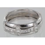 Ladies Platinum ring. Three cross bands set with seventeen princess cut diamonds totalling approx .