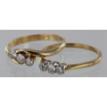 Two 18ct three stone diamond rings, total weight 4.7g