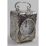 Victorian silver cased miniature carriage clock with ornate embossed decoration, hallmarked 'B.
