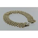 9ct yellow gold seven row panther link bracelet with box clasp and safety clasps, 19cm long,