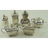 Three silver mustard pots, three silver pepper pots and three silver spoons (only two blue glass