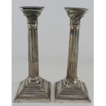 Pair of silver column candlesticks, hallmarked 'B.G, Birmingham, 1962' (Bert Gordan), weight