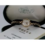 Ladies 9ct cased rolex Precision wristwatch on a 9ct bracelet. In its original green heart shaped