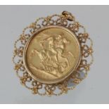 Victorian Sovereign dated 1888 in an ornate 9ct mount. total weight 11.2g