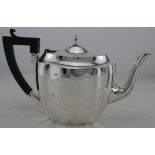 Silver teapot hallmarked F.H.. & Co., Birm. 1922. Weight 17¼oz approx (includes wooden handle).