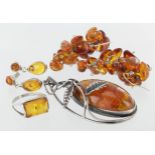 Mixed lot of silver and amber jewellery, comprising of pendant, earrings and ring. Weight 31.5g