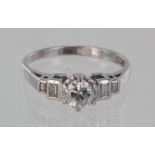 Platinum diamond solitaire ring with baguette diamond shoulders, principal diamond approx. 0.50ct,