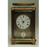 Brass five glass carriage clock, enamel dial with Roman numerals, ornate surround, secondary alarm