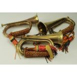 Bugles. Three brass & copper bugles, each with a crest depicting a lion (one missing mouthpiece)