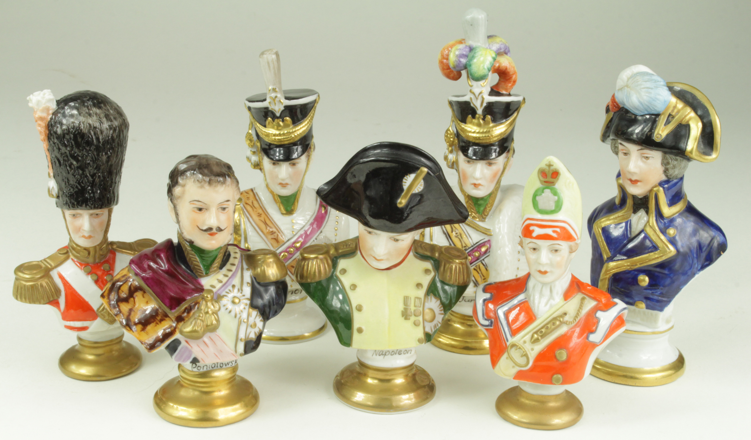 Porcelain busts. A collection of seven hand painted porcelain busts, mostly by Rudolf Kammer,